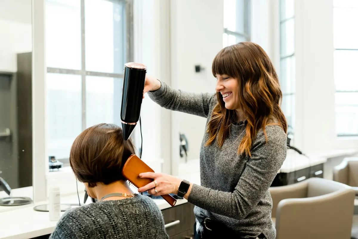 A signature Lumière balayage — hand-painted dimension on a soft champagne base